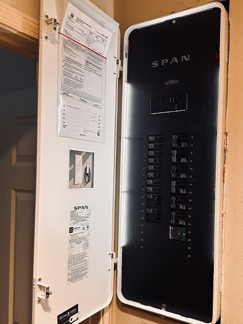 SPAN smart electrical panel open and installed in residential home showing upgraded electrical system in Southern California