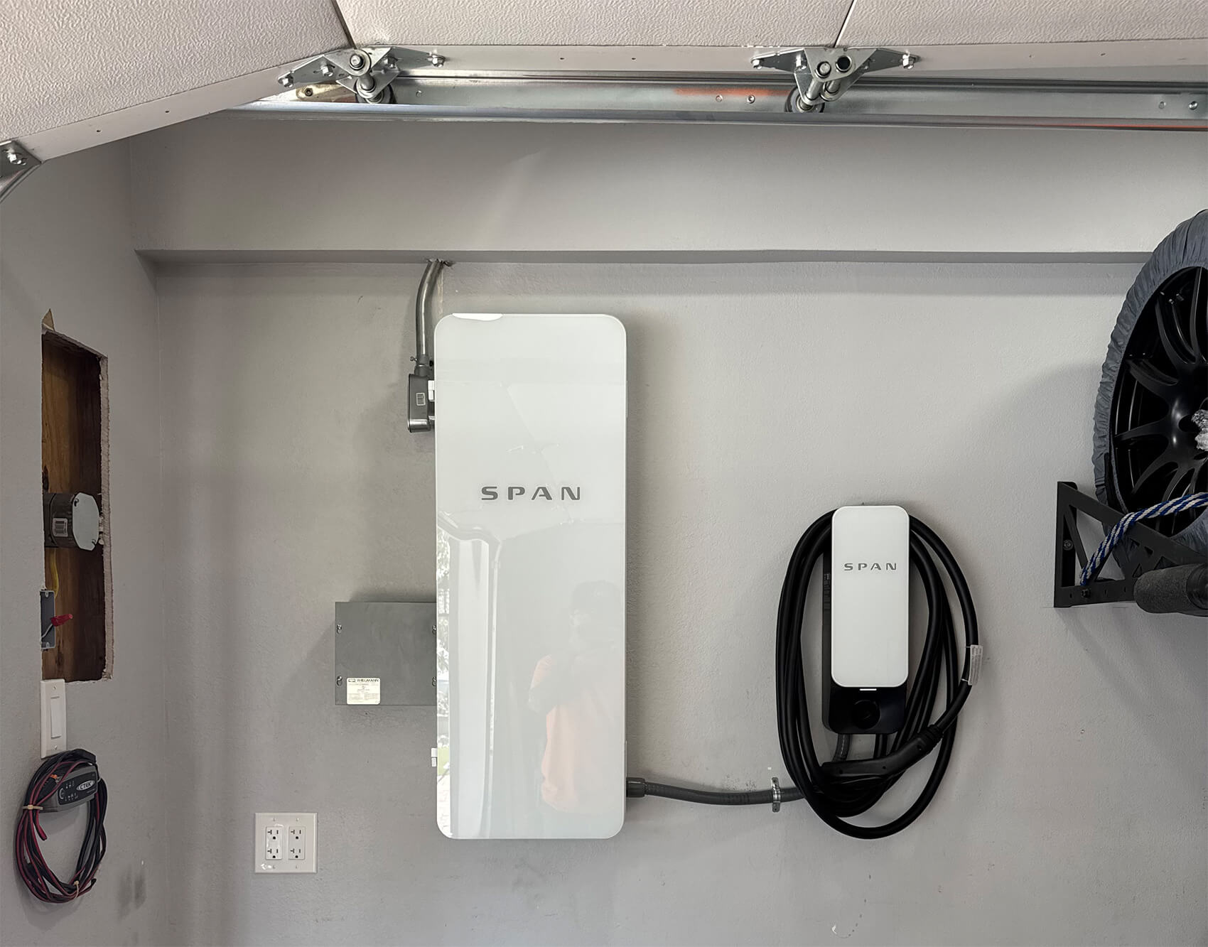 SPAN smart electrical panel and EV charger installed in residential garage for efficient home energy management in Southern California