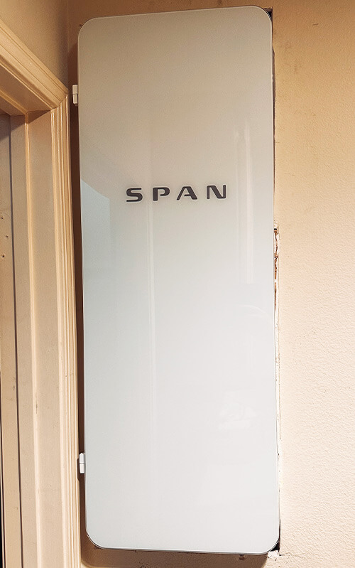 SPAN smart electrical panel closed and installed in residential home for modern energy management in Southern California